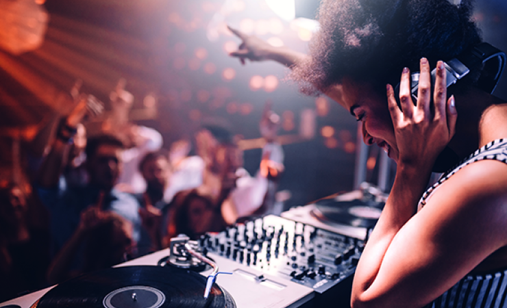 DJ playing to a crowded nightclub